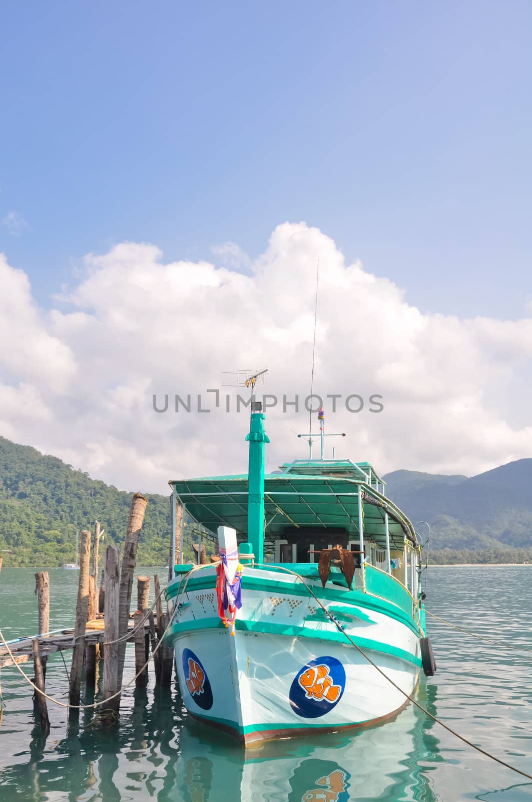 Local tour boat docked at Koh Chang island port, Thailand