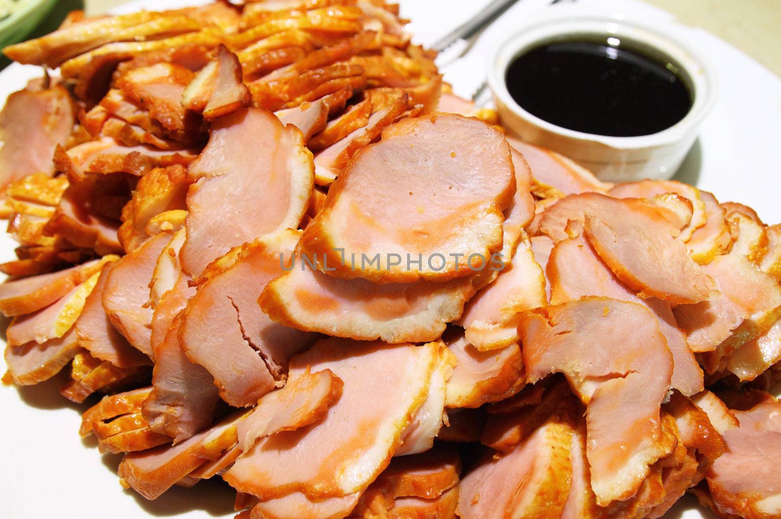 Slices of pork bacon with sauce