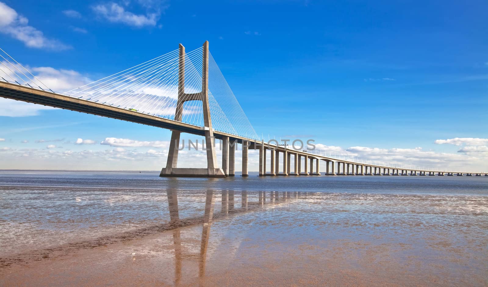 Vasco da Gama bridge in Lisbon, Portugal. On Blue Sky