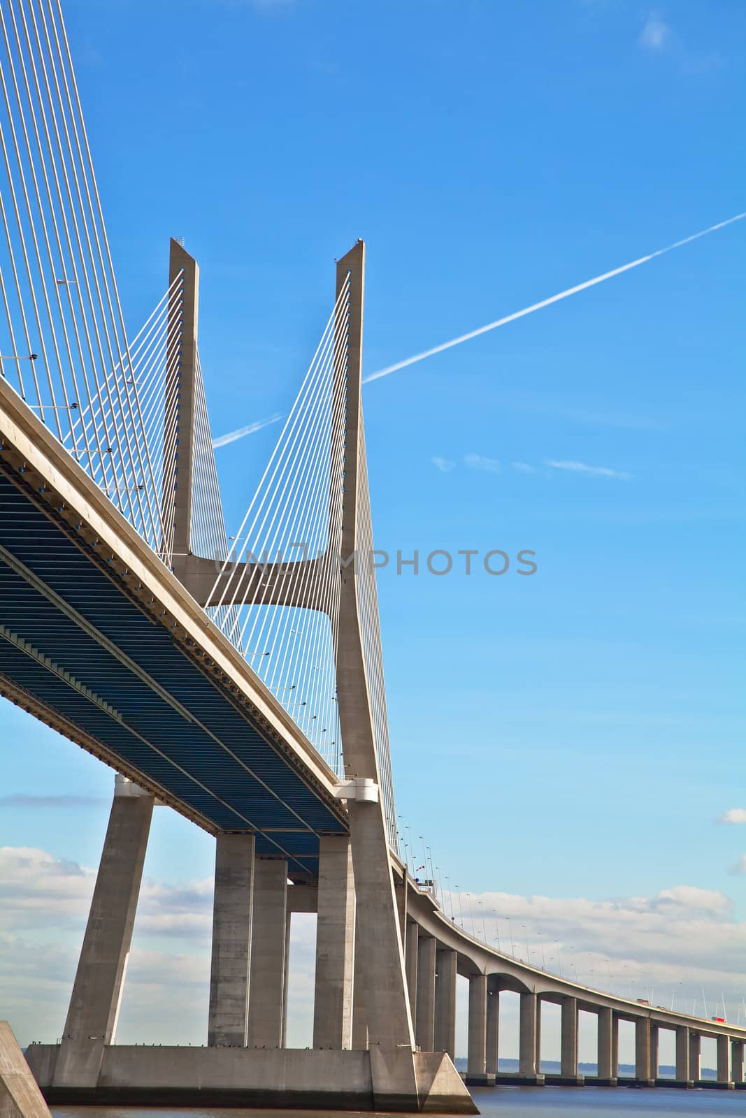 Vasco da Gama bridge in Lisbon, Portugal. On Blue Sky