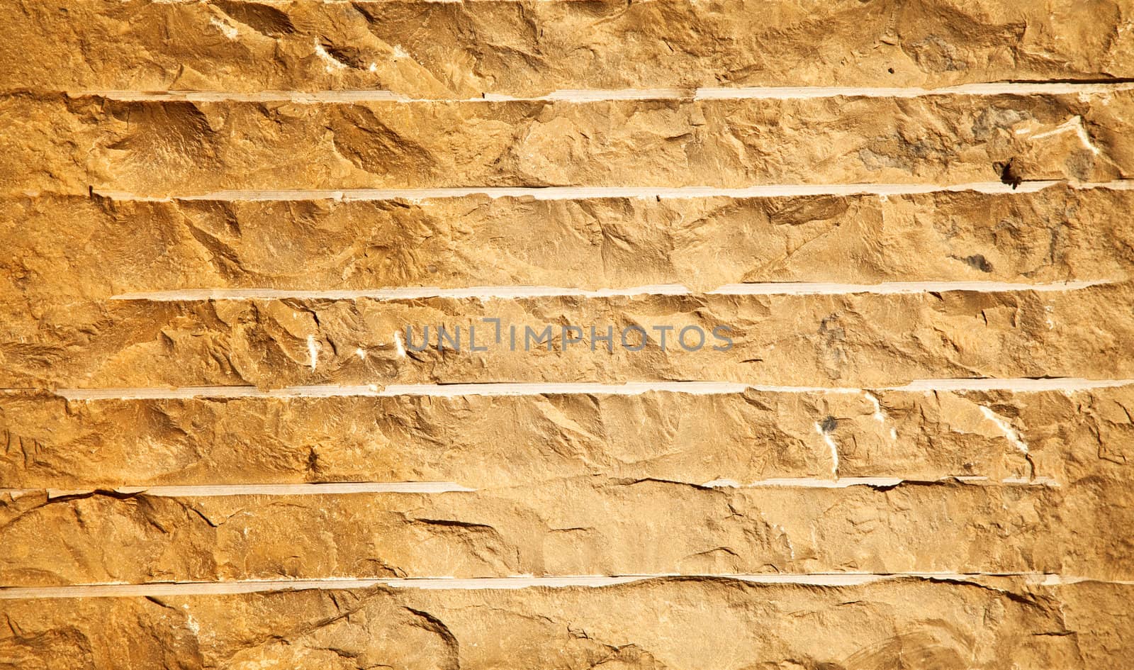 Close up of a brick-wall, texture background. Pattern gray color of cracked real stone wall surface with cement