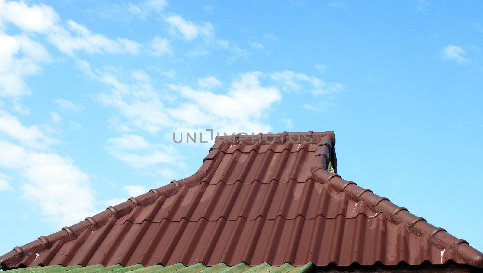 Red roof and cloudy sky