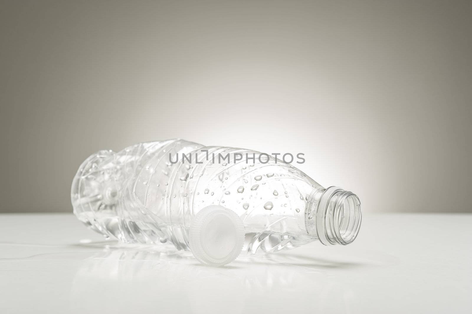 Clear plastic water bottle with droplets by MOELLERTHOMSEN
