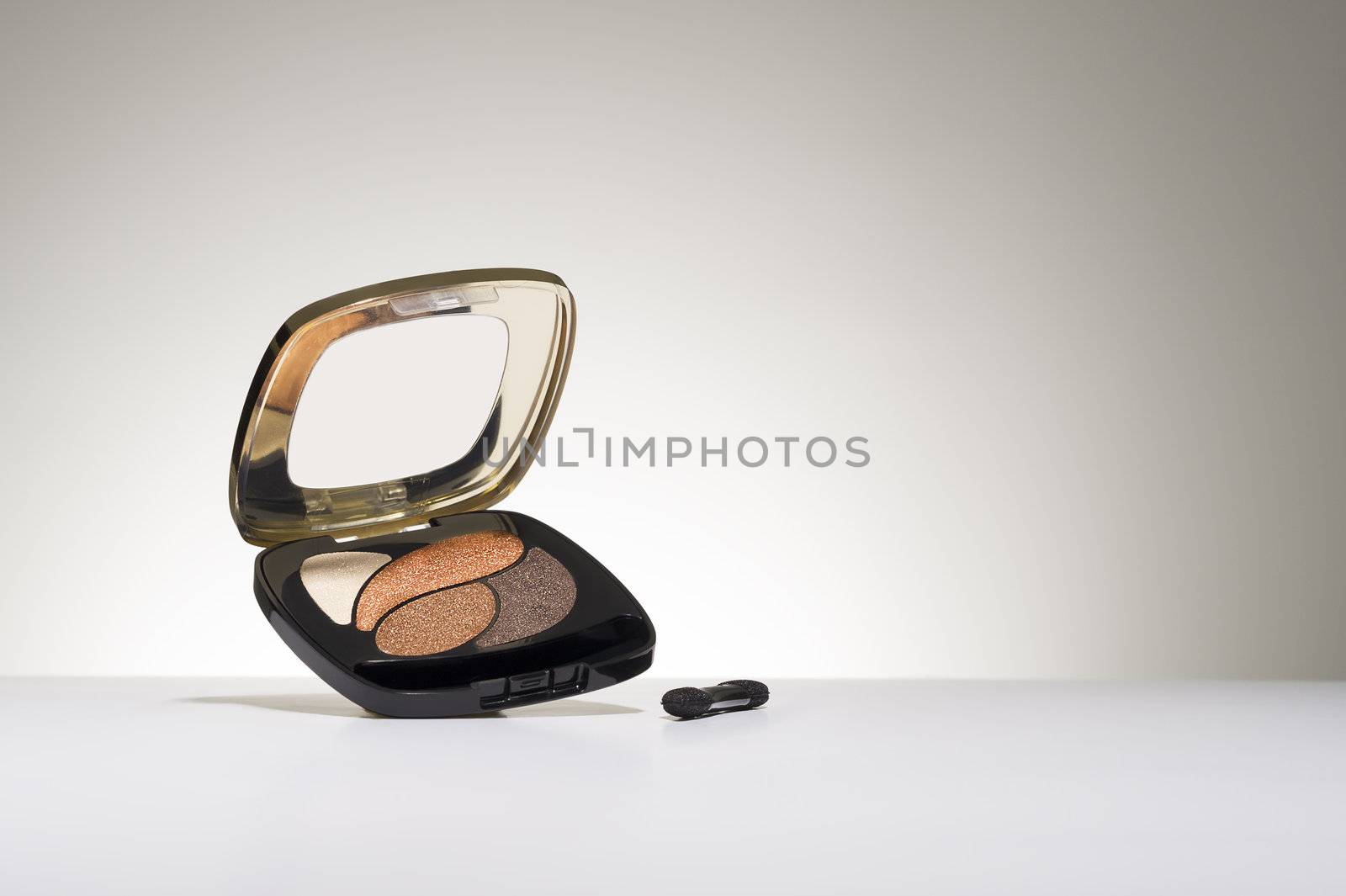 Cosmetics compact with eyeshadow by MOELLERTHOMSEN