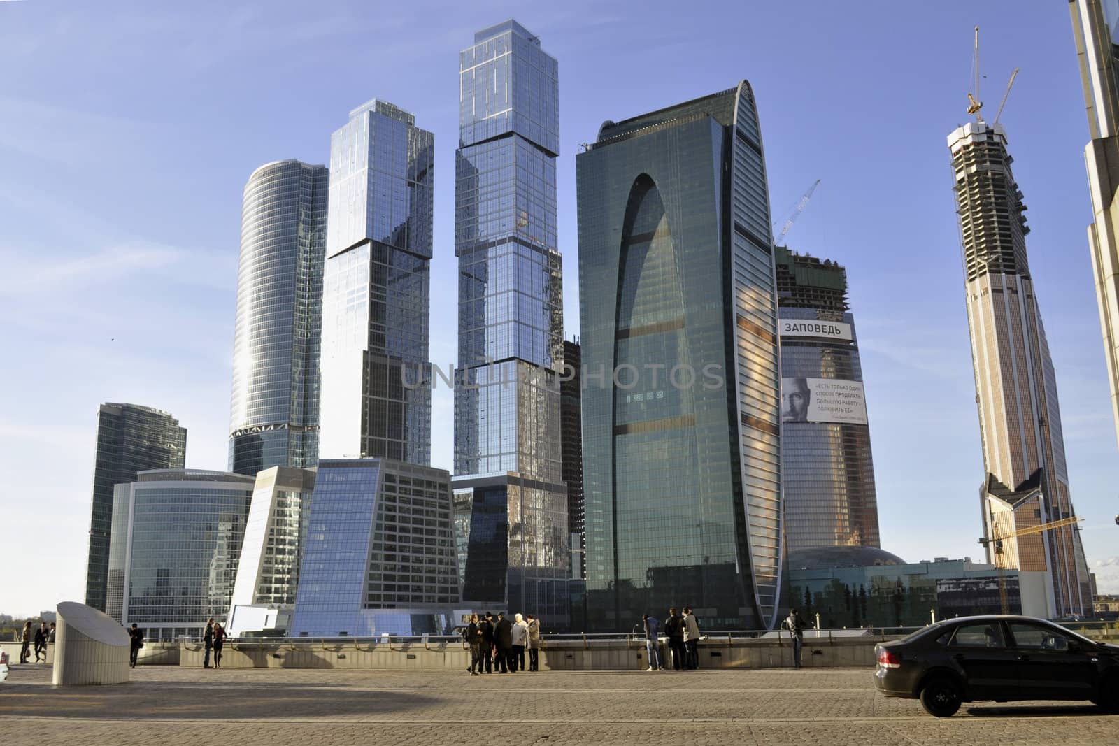 Moscow, Russia - October 22, 2011 : people resting and watching to the towers of modern Moscow International Business Center.