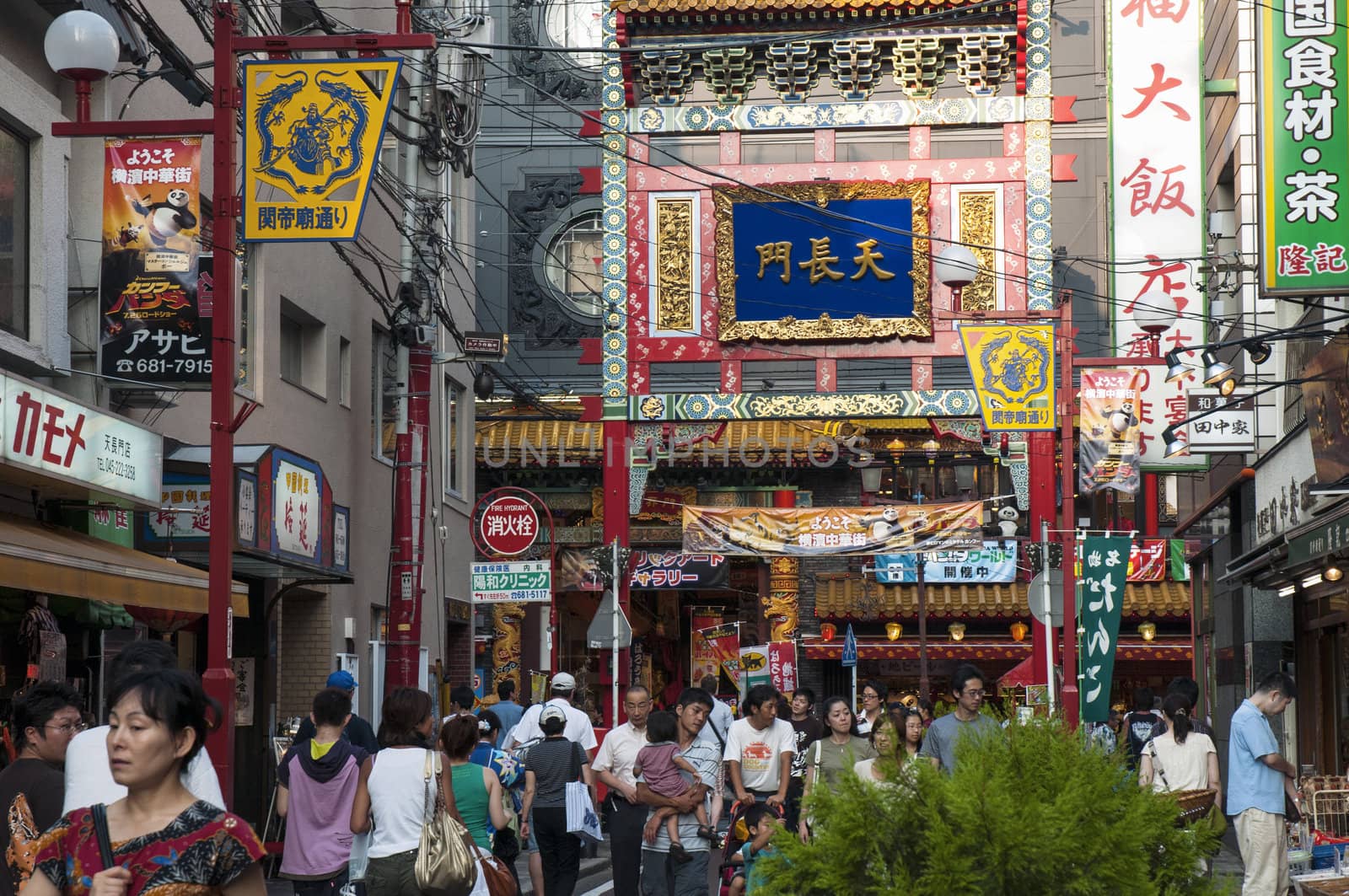 Yokohama, Japan - August 3, 2008:  people crowds walk inside famous Chinatown district in Yokohama. This area is pedestrian streets with many shops and restaurants, this district is known as largest Chinatown in Japan and in Asia.