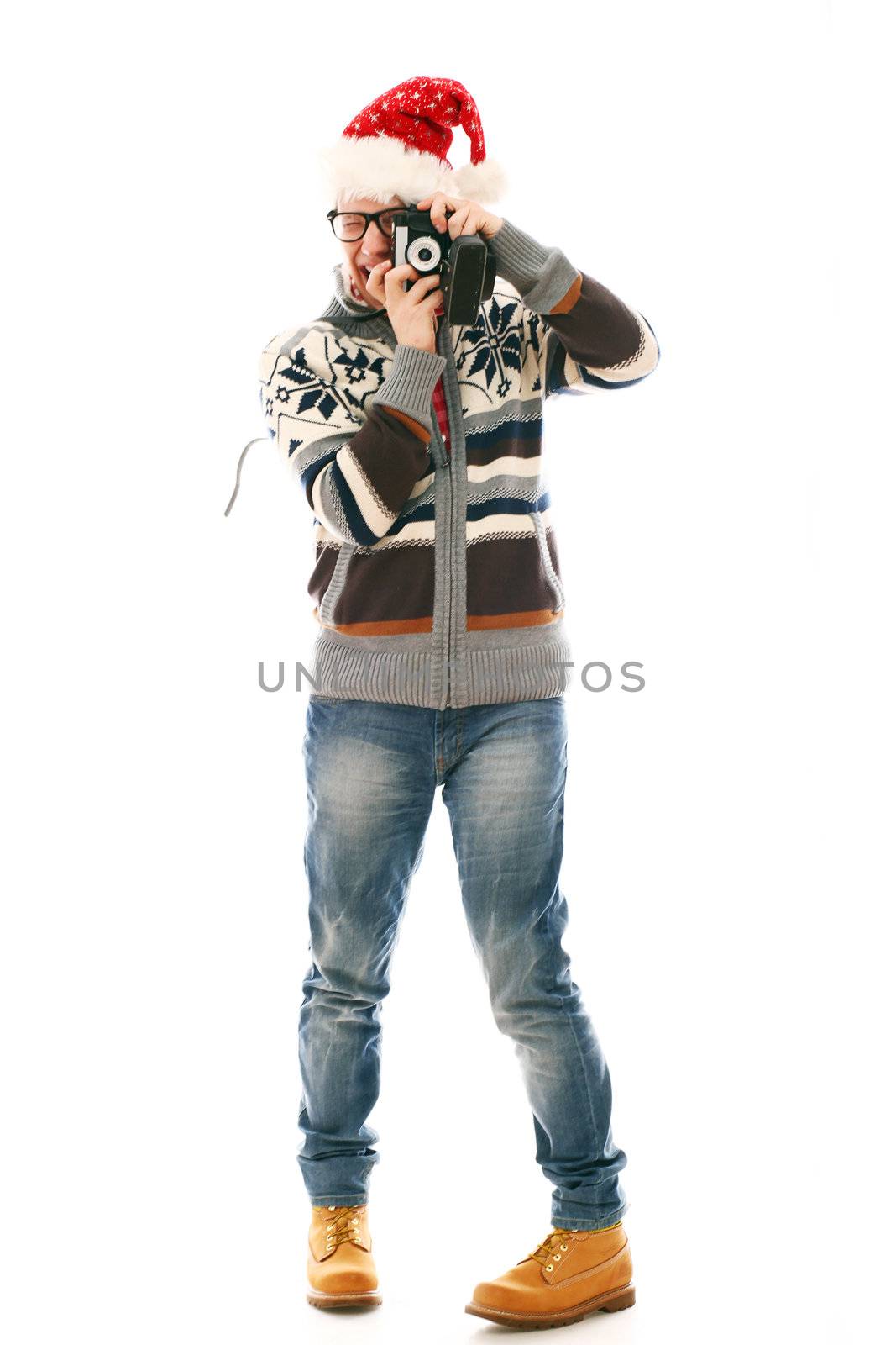 Funny man in christmas hat with camera hat isolated on a wite