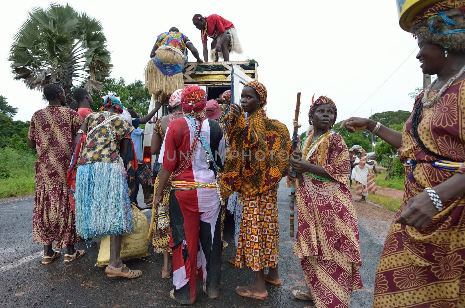 Kartiak,Senegal-September 18,2012 :people on the road go to a ritual of Boukoutt of Initiation ceremony on Sept 18,2012 in Kartiak, Senegal.The ceremony occurs every 30 years and celebrates boys becoming men.