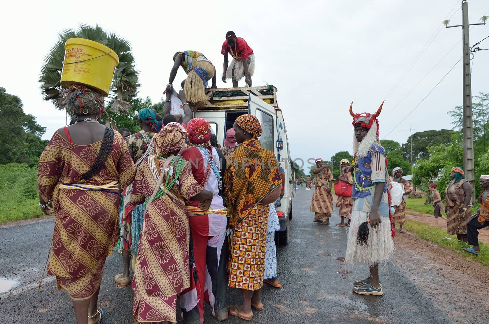 Kartiak,Senegal-September 18,2012 :people on the road go to a ritual of Boukoutt of Initiation ceremony on Sept 18,2012 in Kartiak, Senegal.The ceremony occurs every 30 years and celebrates boys becoming men.