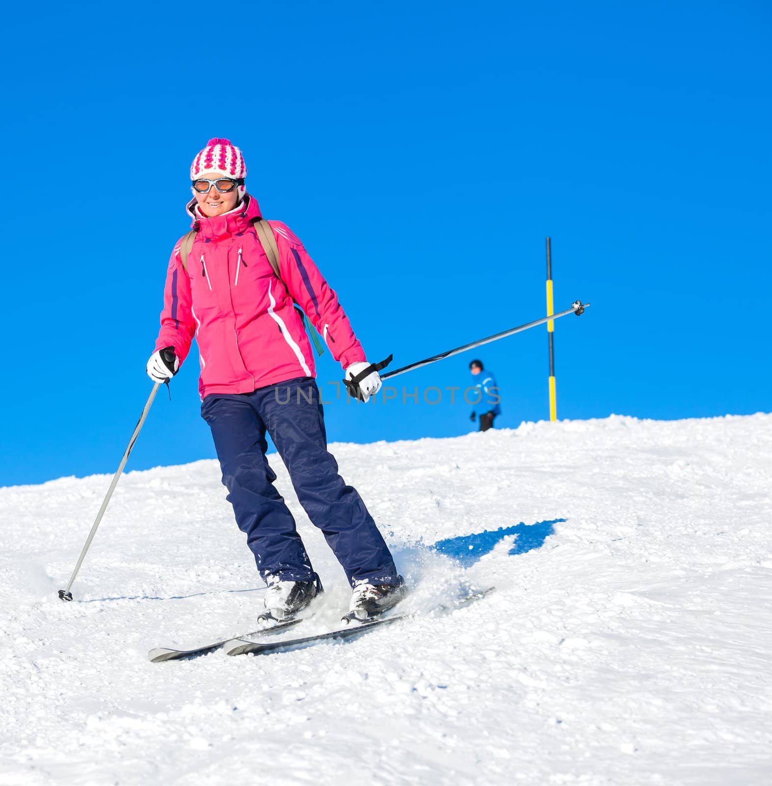 Young woman skiing on mountains in the Zillertal Arena, Austria