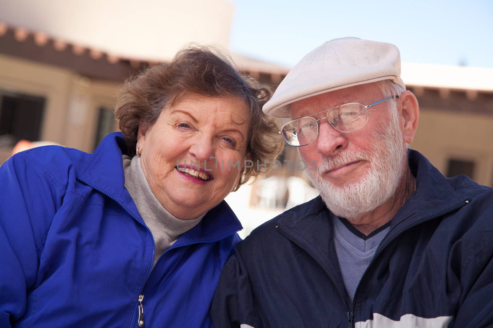Happy Senior Adult Couple Portrait Bundled Up Outdoors.