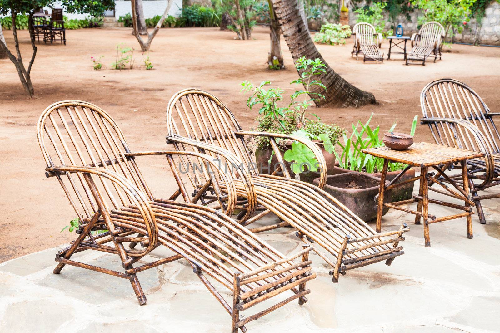 Kenya. Elegant furniture made of wood in an African garden