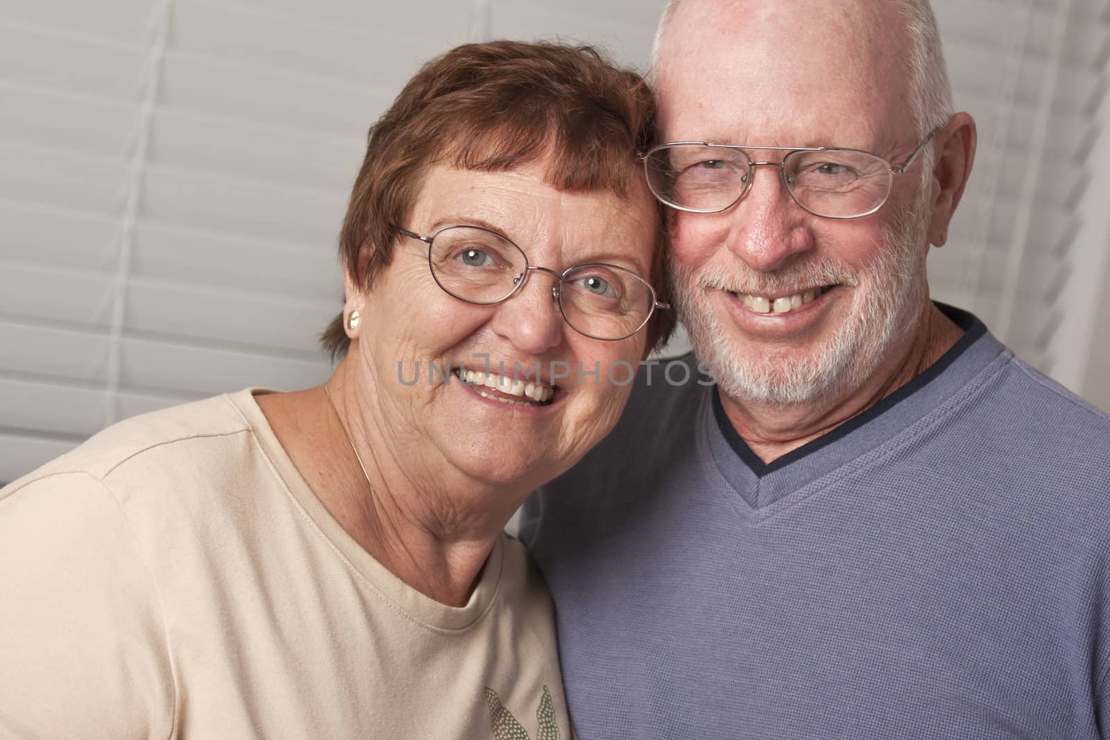 Affectionate Happy Senior Couple Portrait Indoors.