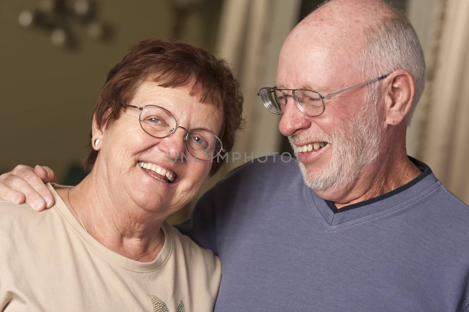 Affectionate Happy Senior Couple Portrait Indoors.