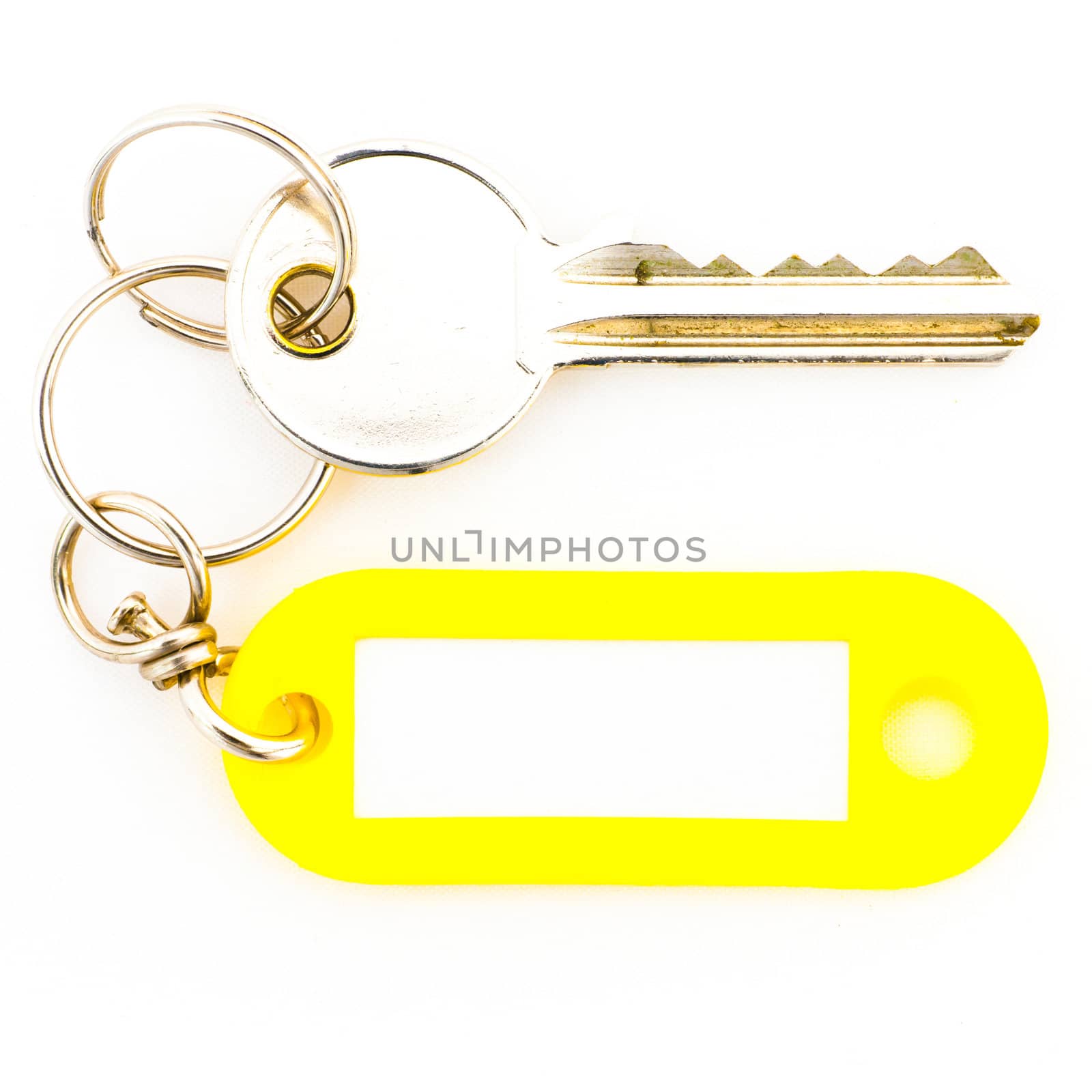 Key with a blank tag, isolate on white background. Add your text on the tag.