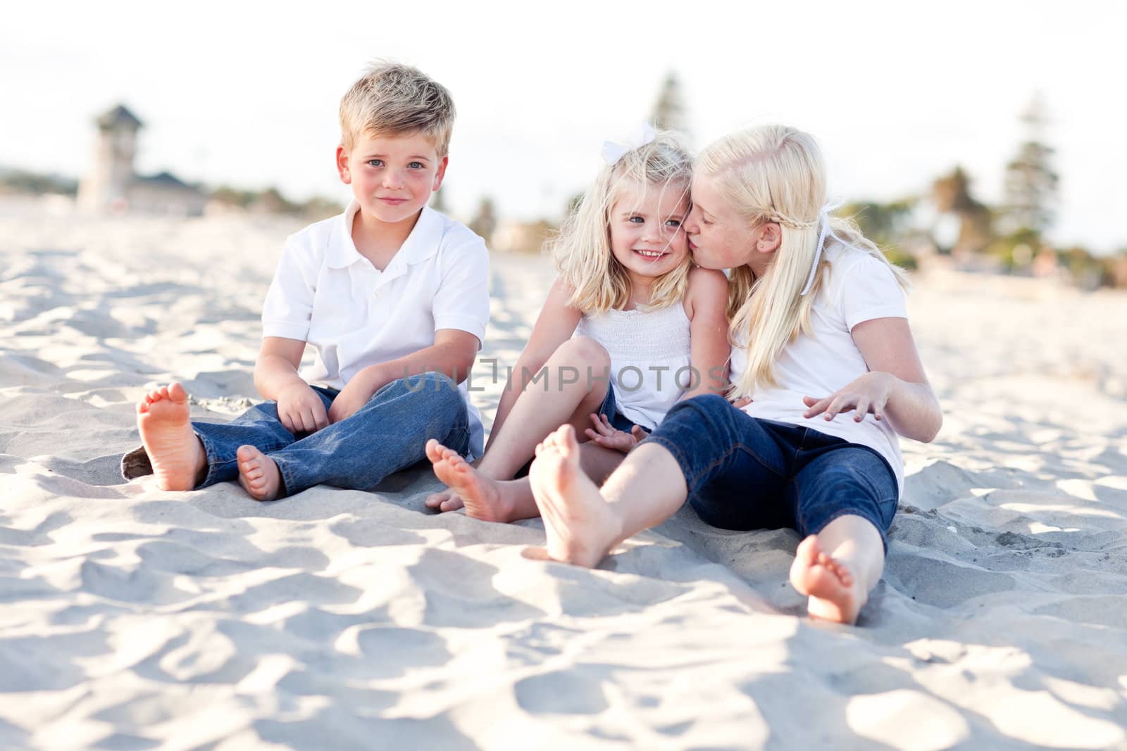 Adorable Sisters and Brother Having A Lot Fun at the Beach.