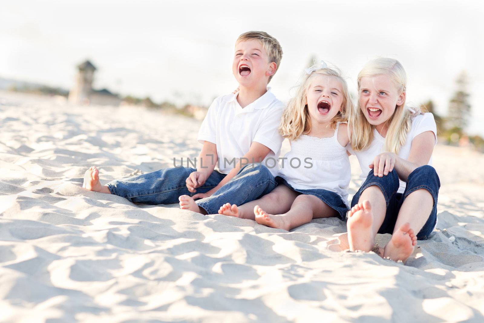 Adorable Sibling Children Portrait at the Beach.