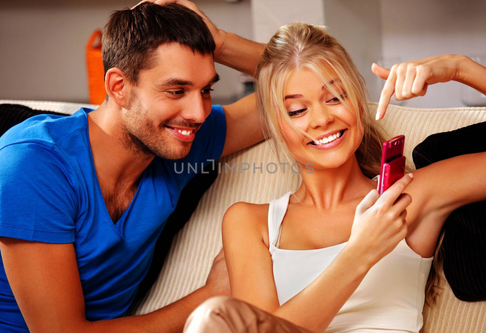 bright picture of happy couple with cellphone