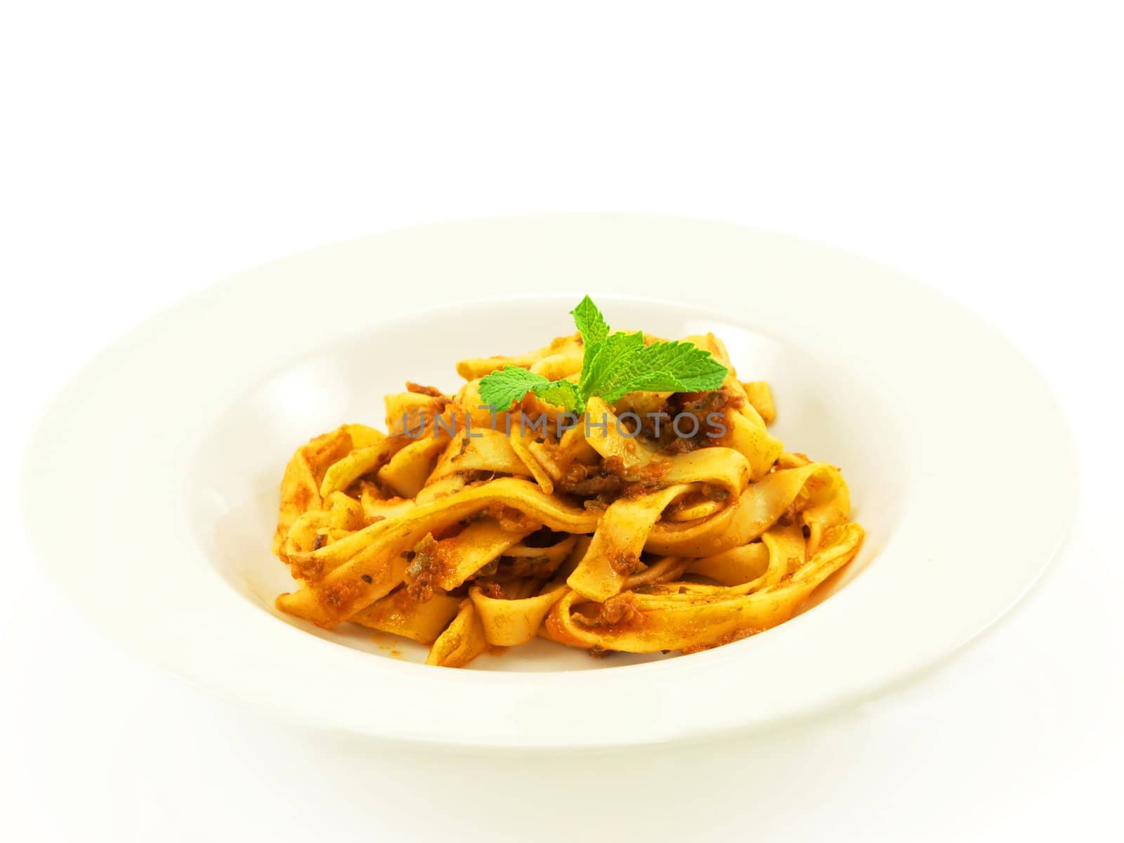 Pasta with meat sauce on towards white background by Arvebettum