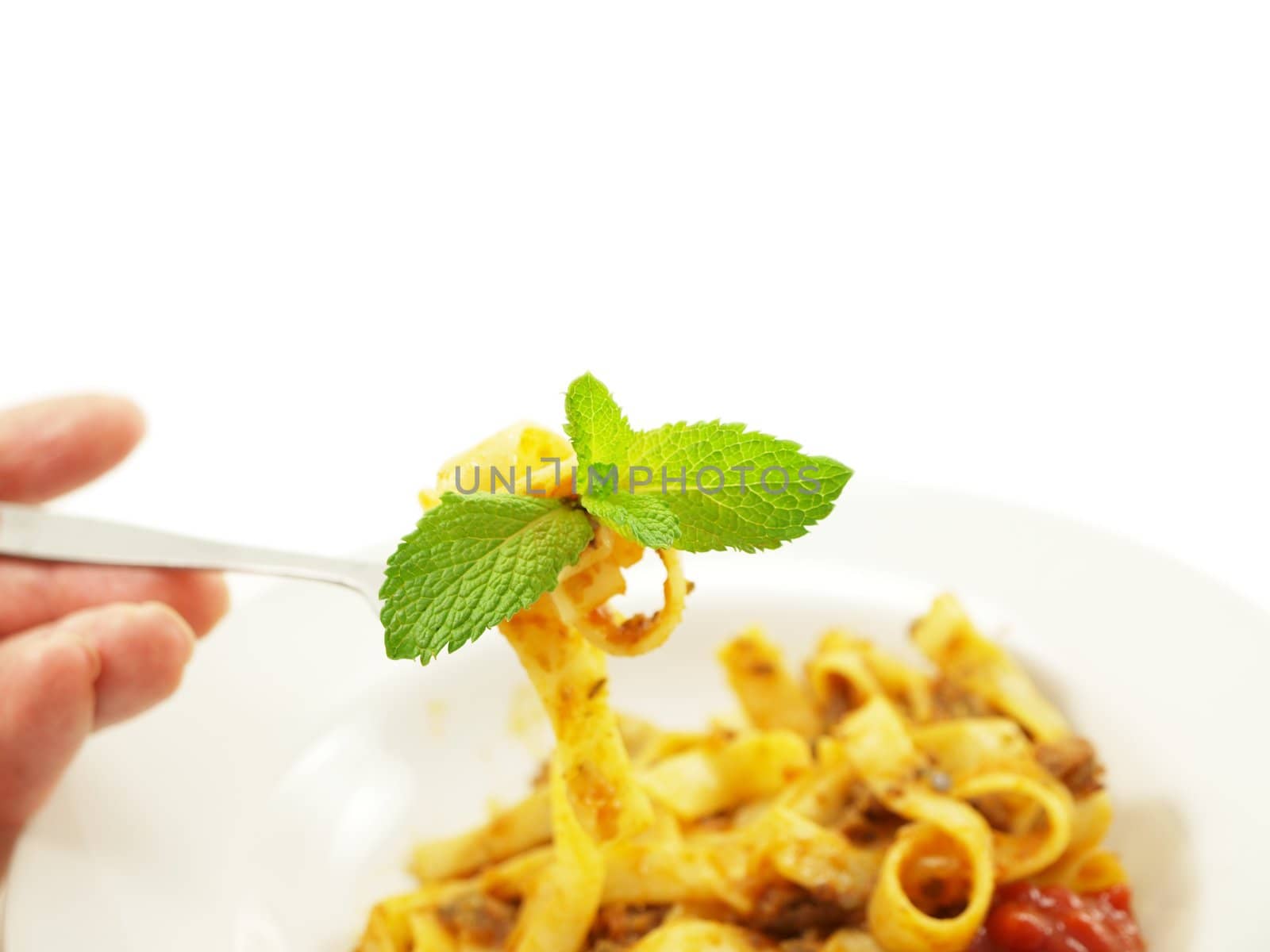 Pasta with meat sauce on towards white background