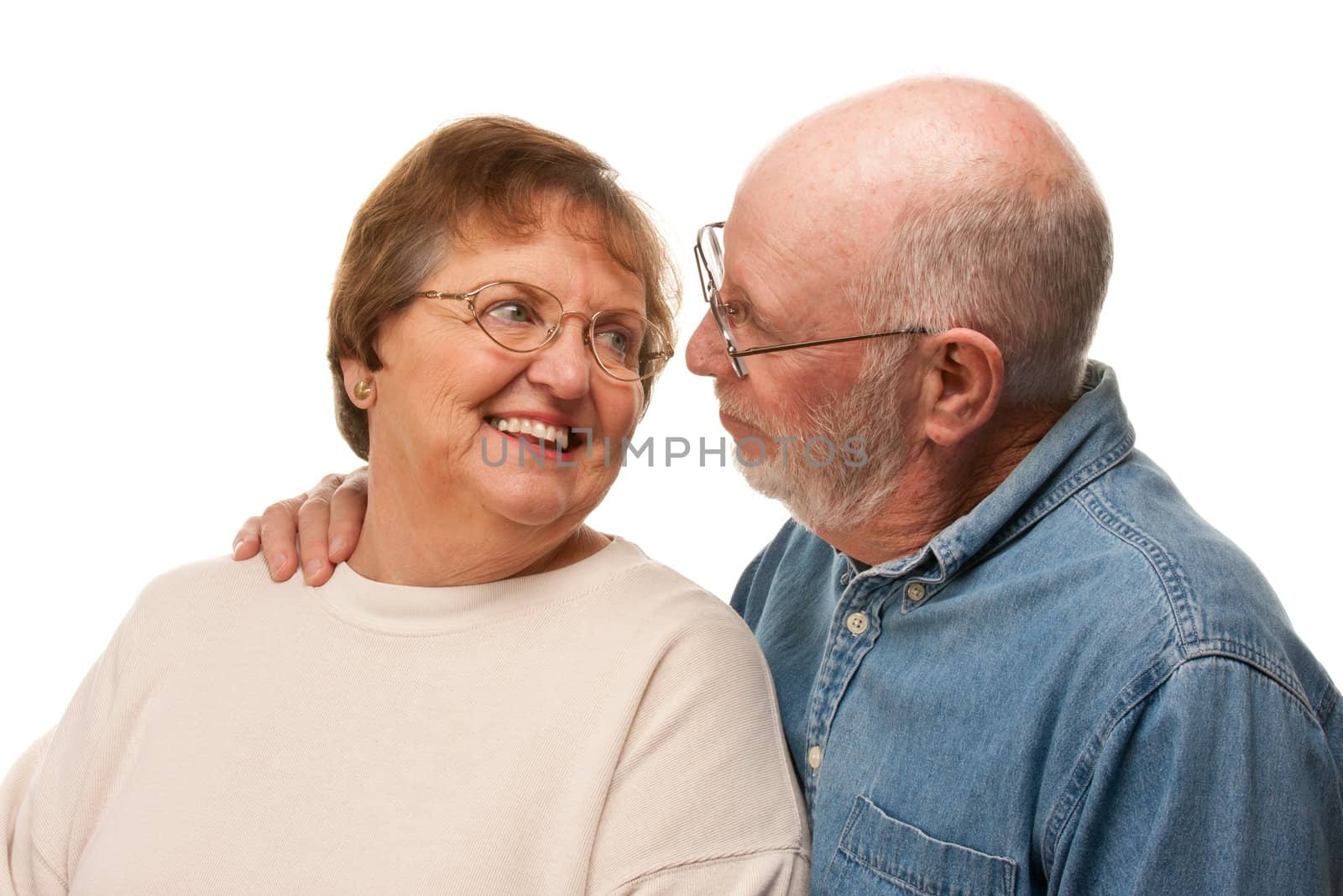 Affectionate Happy Senior Couple Pose For A Portrait.