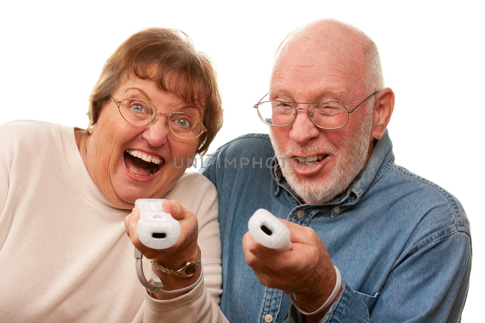 Happy Senior Couple Play Video Game with Remotes by Feverpitched
