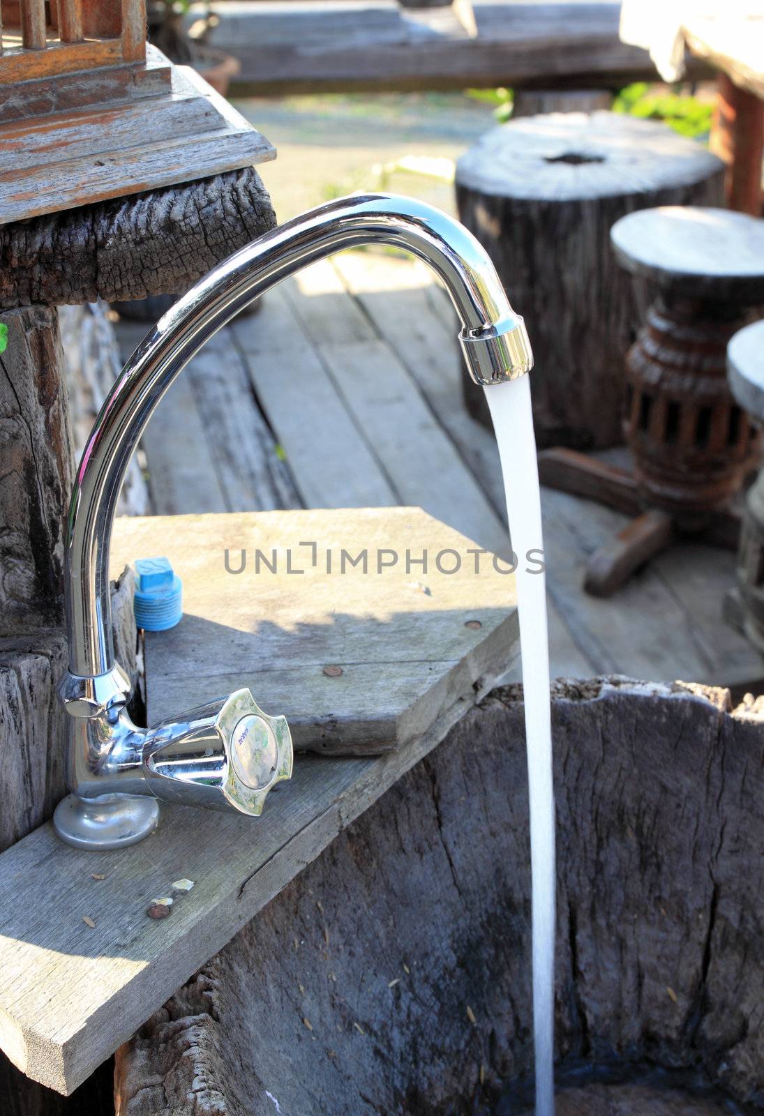 Lifestyle-a faucet with water flowing