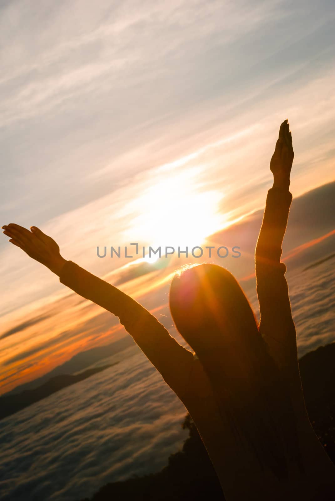 silhouette of young woman over sunset light