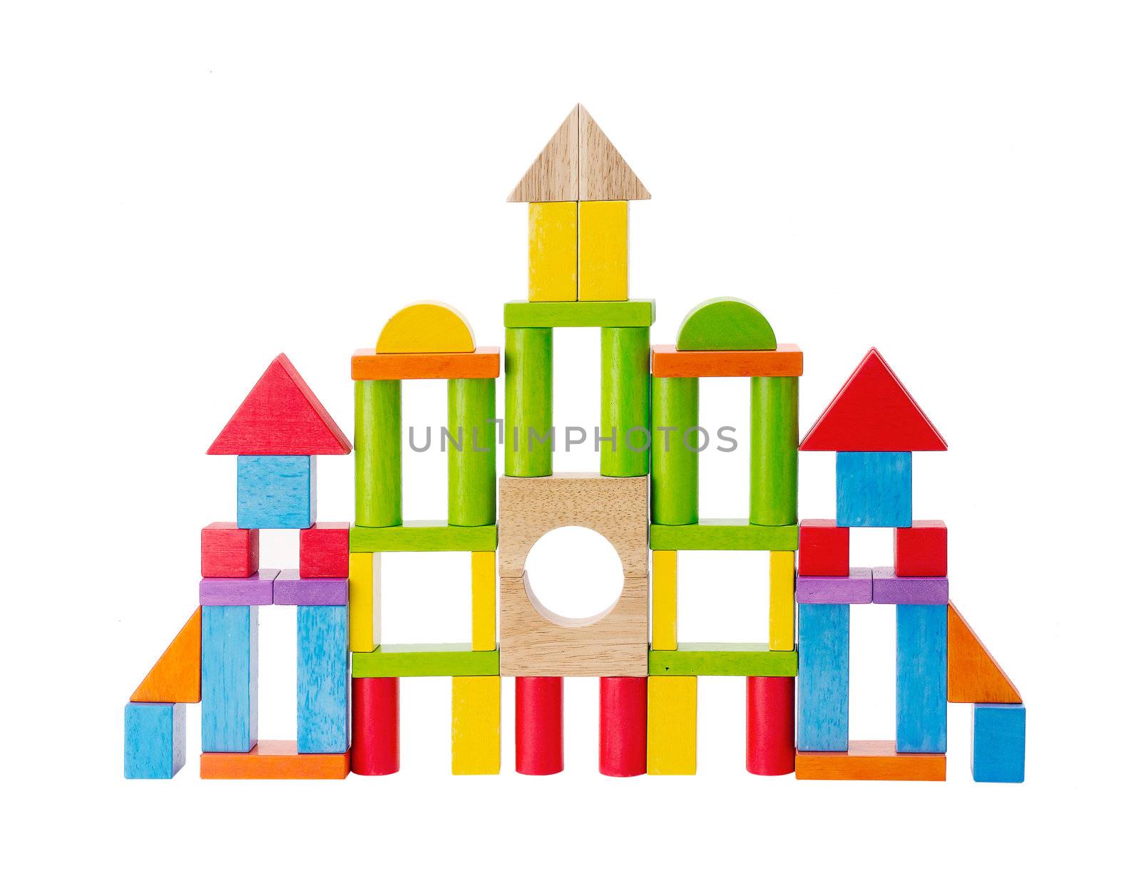 Colorful wooden toy castle on white 