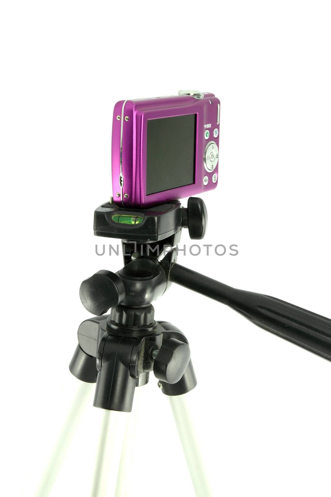 close-up pink camera on a tripod  on a white background