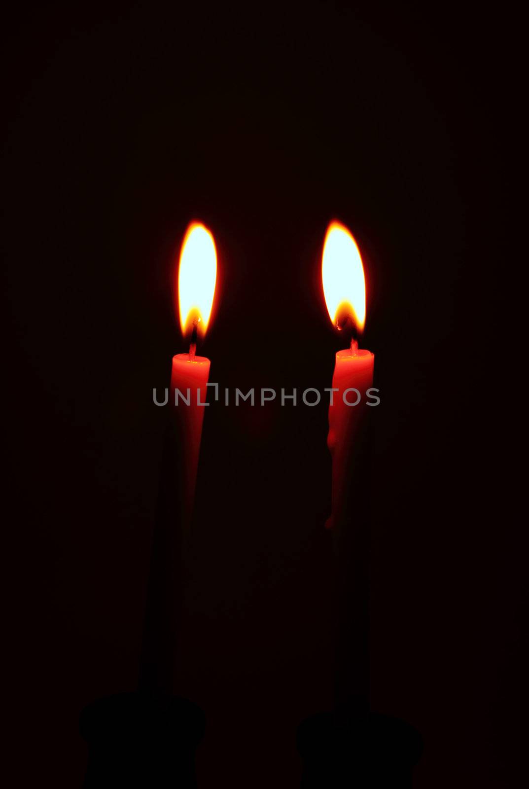 burning candle with antique metal candlestick by geargodz