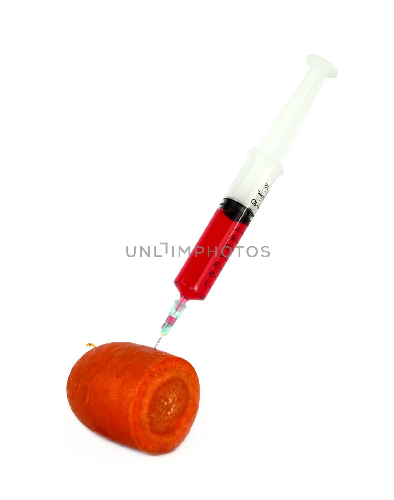carrot with syringe injected isolated on white background