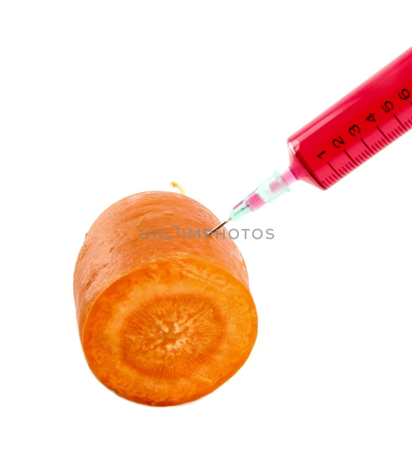 carrot with syringe injected isolated on white background