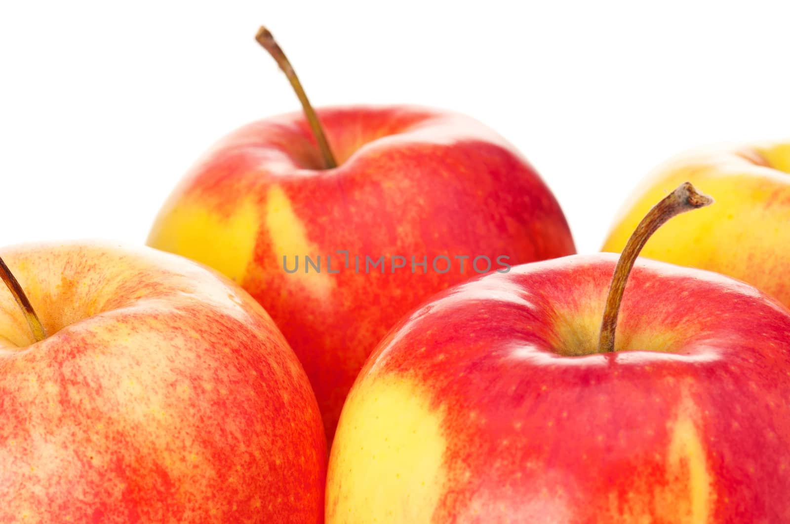 Fresh ripe red and yellow apples on white background