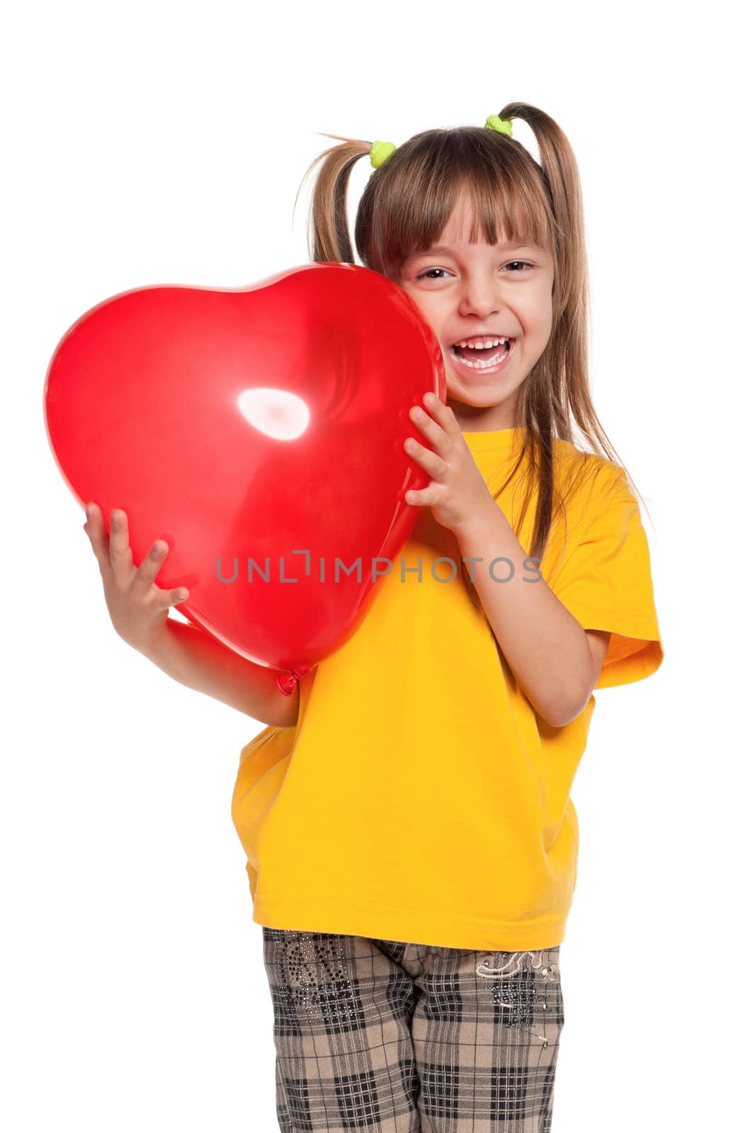 Portrait of little girl with red heart balloon over white background