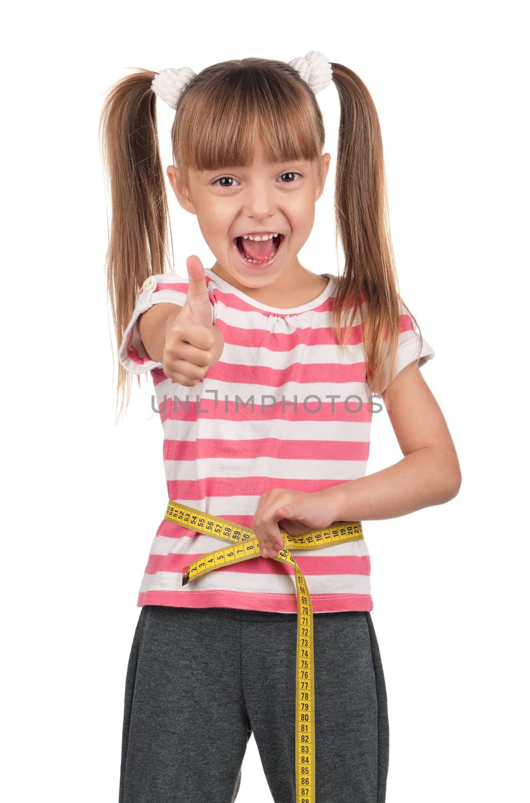 Portrait of little girl with yellow measure over white background