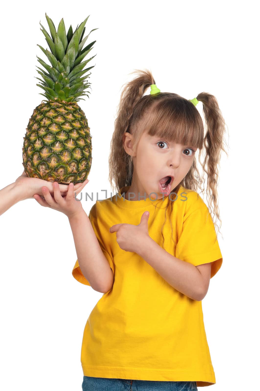 Portrait of surprised little girl with pineapple over white background