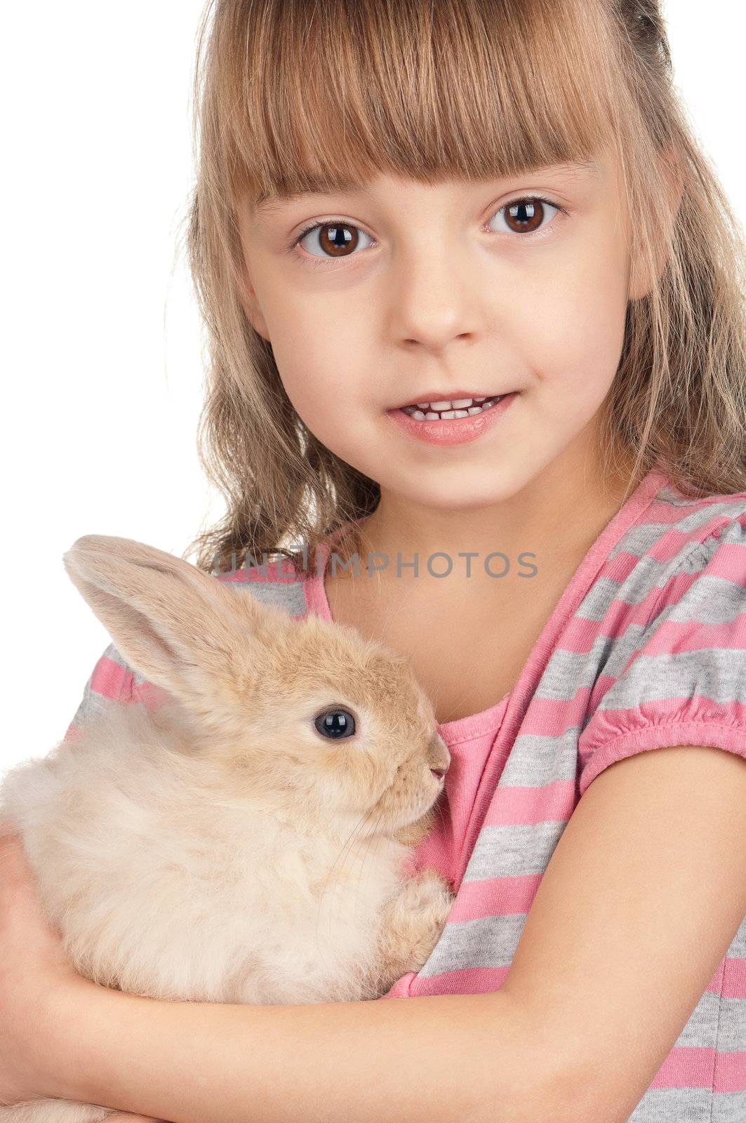 Easter concept image. Portrait of happy little girl with adorable rabbit over white background.