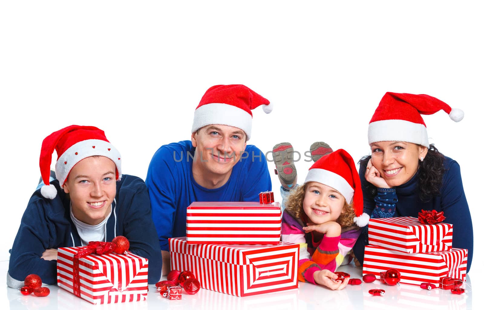 Portrait of friendly family in Santa's hat with gift box, isolated on white