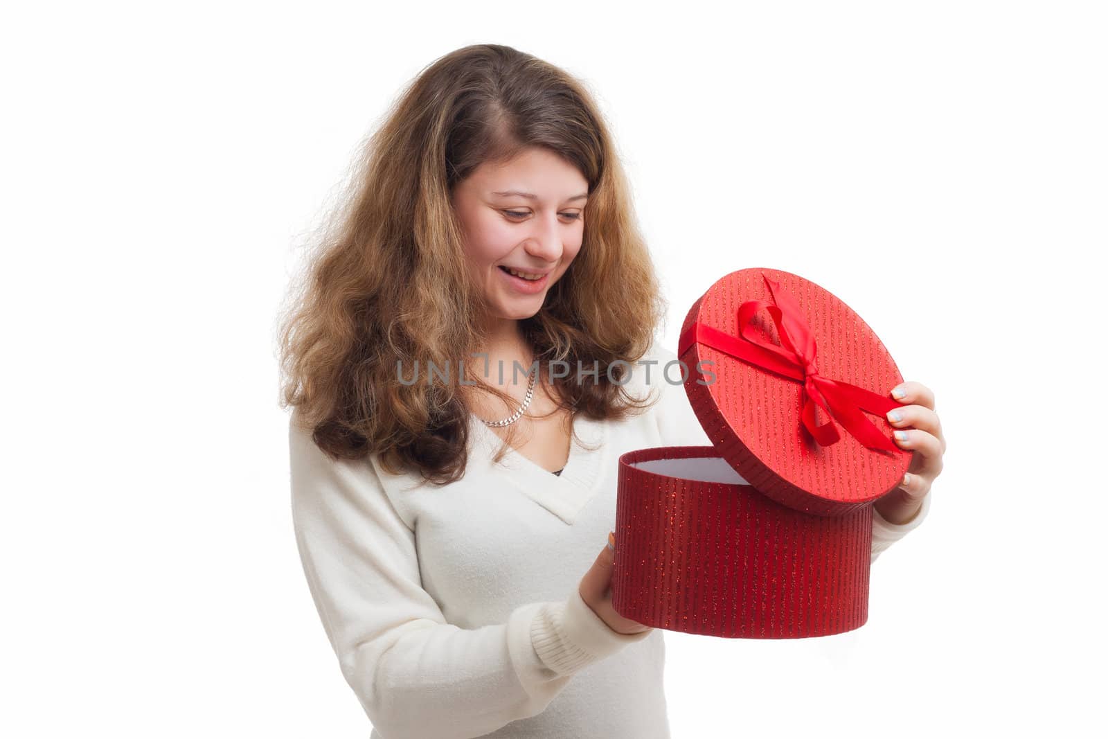 beautiful smiling blond woman opens a red gift box isolated on white 