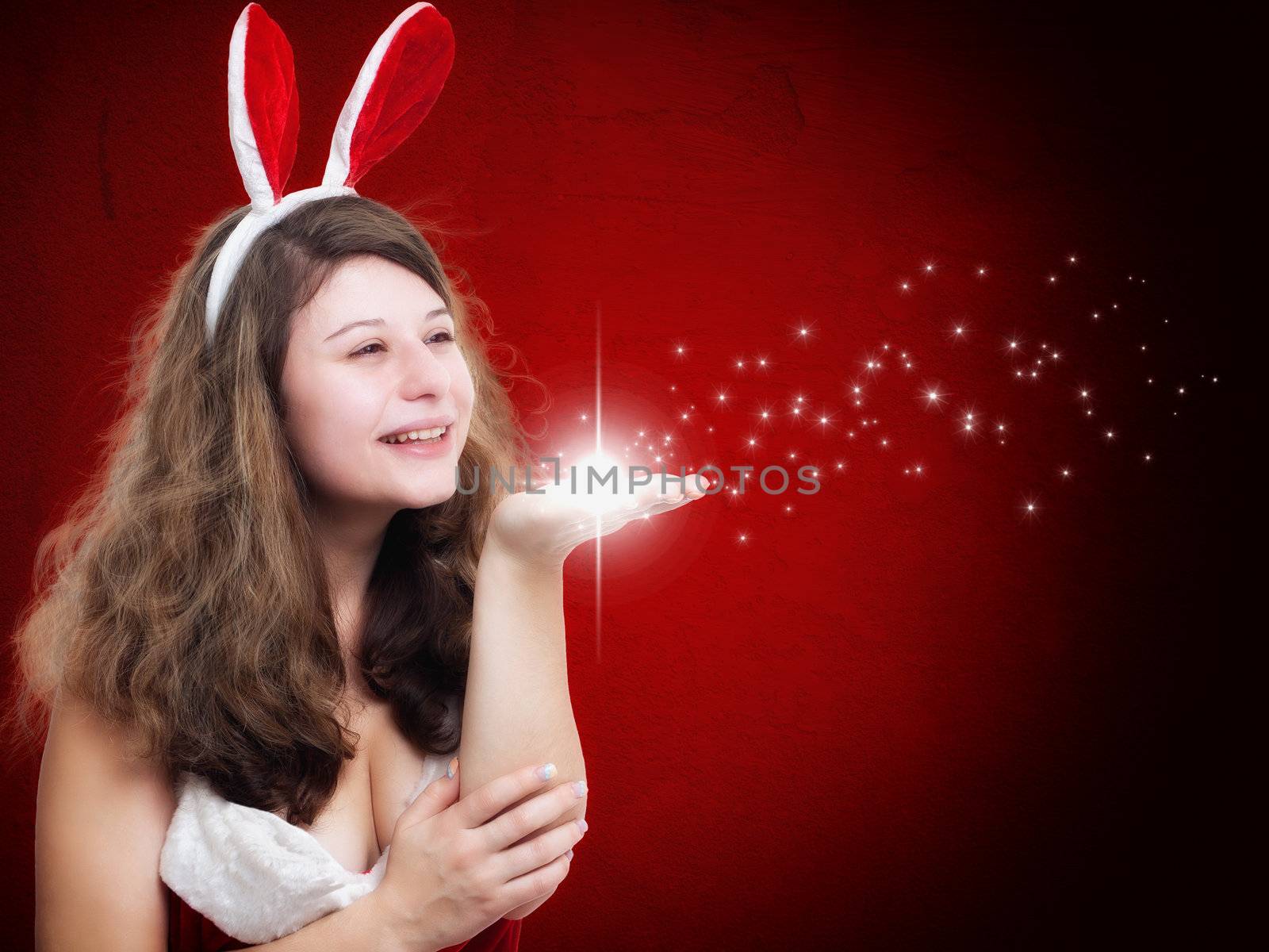 Christmas Woman blowing some stars on red background