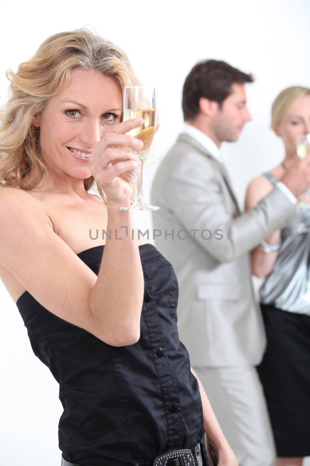 Woman drinking champagne by phovoir