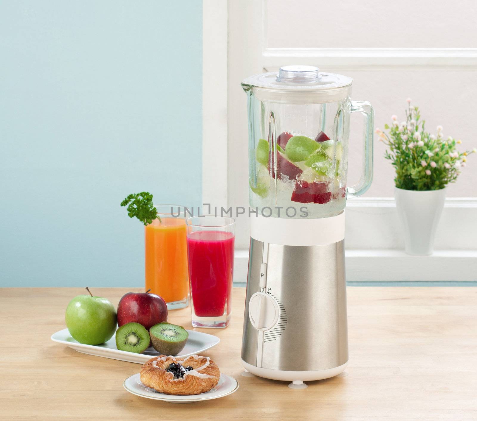 Juice blender machine in the kitchen 