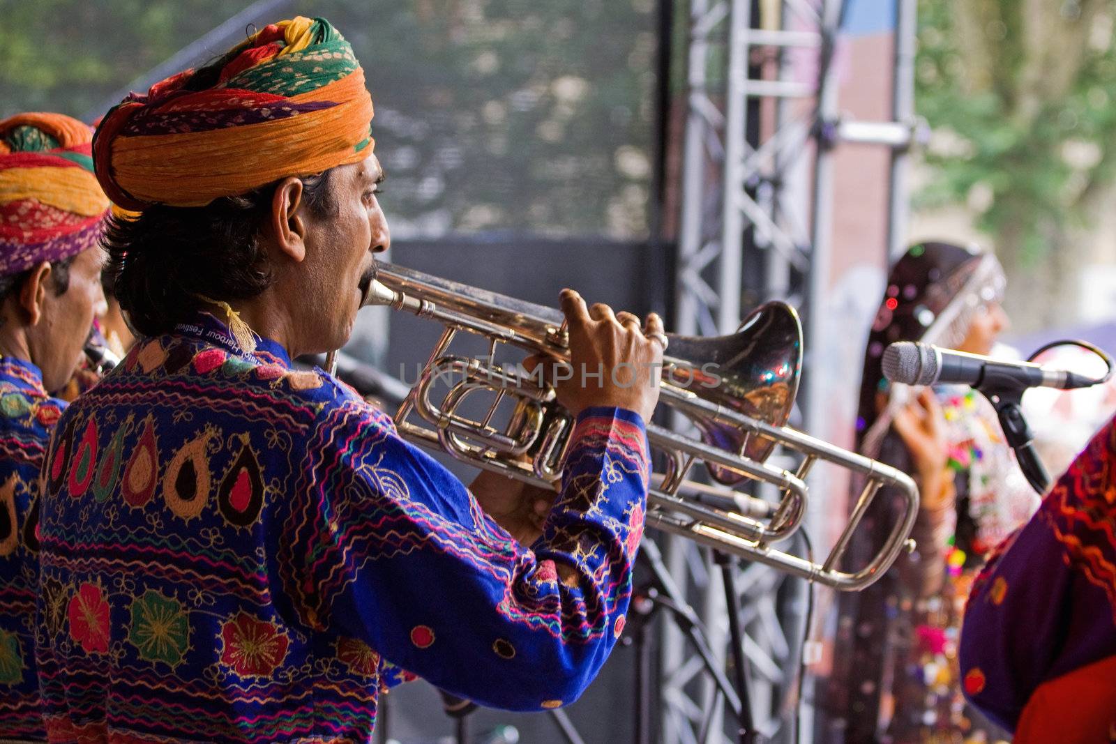 BRISTOL, ENGLAND - JULY 31: Members of the Jaipur Kawa brass band performing at the Harbour Festival in Bristol, England on July 31, 2010. Founded in 1971, this free three day event played host to more than 250,000 spectators