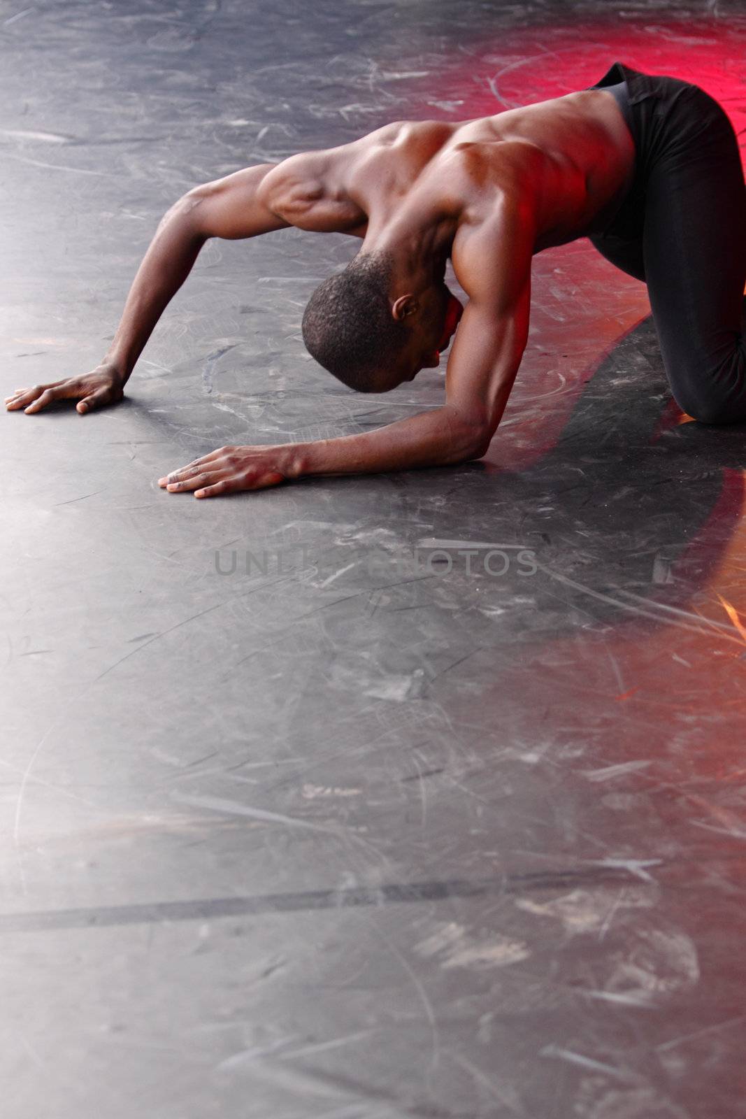 BRISTOL, ENGLAND - JULY 31: Samuel Roberts of the Alvin Ailey American Dance Theater performing ’Damn’ in the Dance Village at the Harbour Festival in Bristol, England on July 31, 2010