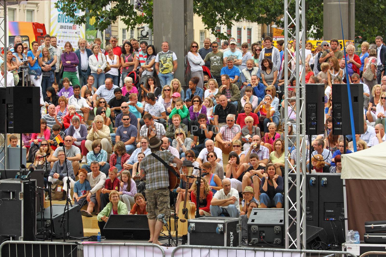 BRISTOL, ENGLAND - JULY 31: Performer out front on the Cascade Steps stage at the Harbour Festival in Bristol, England on July 31, 2010. Founded in 1971, this three day free festival played host to more than 250,000 spectators
