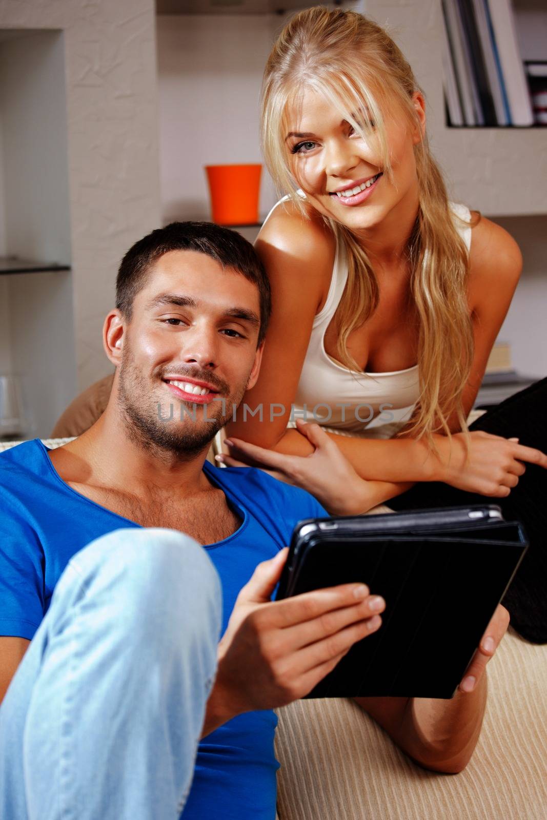 bright picture of happy couple with tablet PC