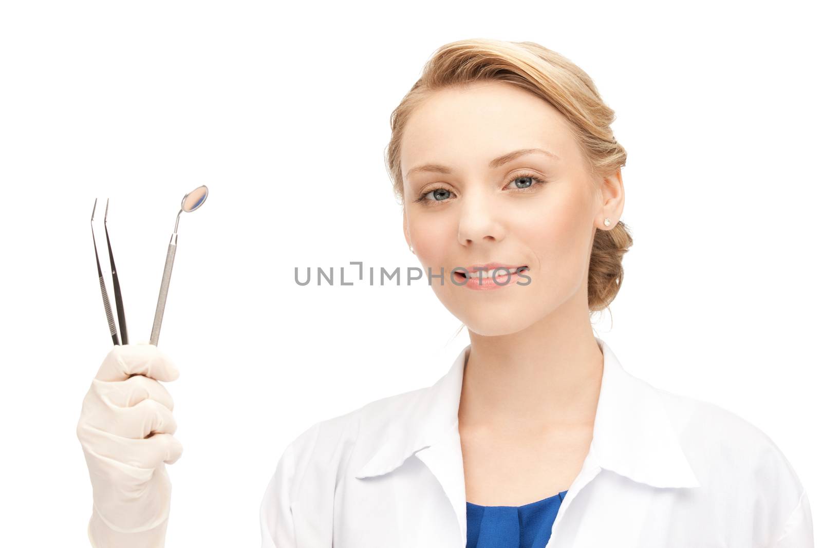 attractive female dentist with tools by dolgachov