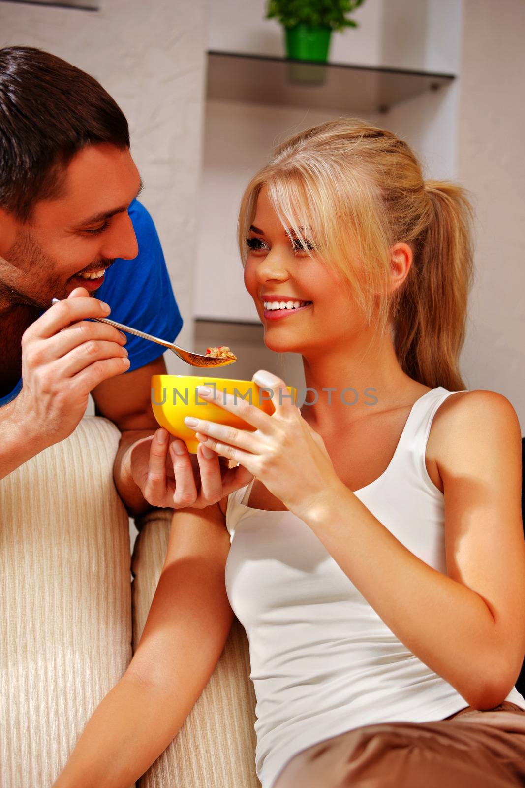 bright picture of happy couple with muesli (focus on woman)