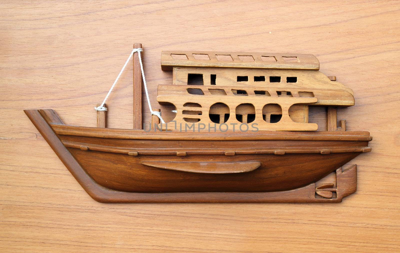 wood boat model on wood background by geargodz